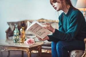 teen girl reading inspirational book